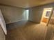 Spacious bedroom with carpeted floors and access to an ensuite bathroom at 227 N Lamb Blvd # A, Las Vegas, NV 89110