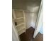 A storage closet features tiled floor and shelving for optimal organization at 227 N Lamb Blvd # A, Las Vegas, NV 89110