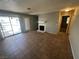 Cozy living room features tile floors, a fireplace, and access to the outdoor space at 227 N Lamb Blvd # A, Las Vegas, NV 89110