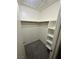 Walk-in closet with built-in shelves and carpeting provides ample storage space at 227 N Lamb Blvd # A, Las Vegas, NV 89110
