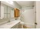 Bathroom featuring a tub/shower combo, vanity, and mirrored medicine cabinet at 2349 Wooster Cir # A, Las Vegas, NV 89108