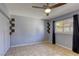 Bedroom with a ceiling fan, neutral walls, and tiled floor at 2349 Wooster Cir # A, Las Vegas, NV 89108