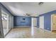Spacious living room featuring tile flooring and sliding glass doors for ample natural light at 2349 Wooster Cir # A, Las Vegas, NV 89108