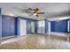 Open concept living room featuring tile floors, ceiling fans, and access to the kitchen at 2349 Wooster Cir # A, Las Vegas, NV 89108
