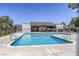 Community pool with clear blue water, surrounded by fencing and landscaping on a sunny day at 2349 Wooster Cir # A, Las Vegas, NV 89108