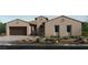 A single-story home features desert landscaping and an attached two-car garage at 237 Paraggi Bay Dr, Henderson, NV 89011
