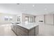 Spacious kitchen island with sink, modern faucet, and open living area at 237 Paraggi Bay Dr, Henderson, NV 89011