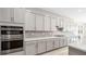 Modern kitchen with stainless steel appliances and long white countertop at 237 Paraggi Bay Dr, Henderson, NV 89011