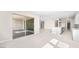 Open-concept living area with modern tile flooring, recessed lighting, and large sliding glass doors to the outdoor patio at 237 Paraggi Bay Dr, Henderson, NV 89011