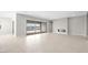 Expansive living room with a modern fireplace, recessed lighting, large sliding glass doors to the outside, and tile floors at 237 Paraggi Bay Dr, Henderson, NV 89011