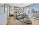 Bright bedroom with a sitting area, large windows, modern decor, and neutral tones creating a serene and inviting space at 243 Paraggi Bay Dr, Henderson, NV 89011