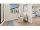 Cozy room featuring a wooden desk area and view to the main bathroom at 243 Paraggi Bay Dr, Henderson, NV 89011