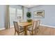 Bright dining room with hardwood floors and views of the backyard at 243 Paraggi Bay Dr, Henderson, NV 89011