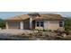 Charming single-story home with desert landscaping and a two-car garage at 243 Paraggi Bay Dr, Henderson, NV 89011
