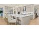 Modern kitchen with stainless steel appliances, marble countertops, and island seating at 243 Paraggi Bay Dr, Henderson, NV 89011