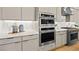 Elegant kitchen featuring modern ovens, gas range, and stylish white countertops at 243 Paraggi Bay Dr, Henderson, NV 89011
