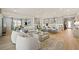 Spacious open-concept living area with light wood floors and a modern kitchen at 243 Paraggi Bay Dr, Henderson, NV 89011