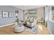 Serene main bedroom with sitting area, natural light, and hardwood floors at 243 Paraggi Bay Dr, Henderson, NV 89011