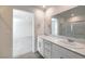Bright bathroom featuring double vanity, quartz countertops, and shower; the perfect blend of comfort and luxury at 2637 Begonia Falls Ave # 87, North Las Vegas, NV 89081