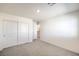 Carpeted bedroom with a large closet offers a quiet retreat and ample storage, designed for comfort and convenience at 2637 Begonia Falls Ave # 87, North Las Vegas, NV 89081