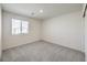 Comfortable carpeted bedroom with window offering an adaptable living space to suit personal needs and preferences at 2637 Begonia Falls Ave # 87, North Las Vegas, NV 89081