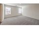 Carpeted bedroom with large windows and neutral walls at 2637 Begonia Falls Ave # 87, North Las Vegas, NV 89081