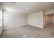 Spacious bedroom provides a large open living space with soft carpet, and natural light from the window at 2637 Begonia Falls Ave # 87, North Las Vegas, NV 89081