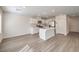 Modern eat-in kitchen with white cabinets, stainless appliances and a large center island perfect for entertaining at 2637 Begonia Falls Ave # 87, North Las Vegas, NV 89081