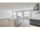 Bright, open kitchen featuring an island, stainless steel appliances, and hardwood floors at 2637 Begonia Falls Ave # 87, North Las Vegas, NV 89081