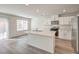 Modern eat-in kitchen featuring stainless appliances and an eat-in island with lovely counters at 2637 Begonia Falls Ave # 87, North Las Vegas, NV 89081