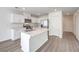 Eat-in kitchen featuring stainless appliances, an eat-in island and lots of natural light at 2637 Begonia Falls Ave # 87, North Las Vegas, NV 89081