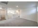 Upstairs living space with carpeted floors and ample lighting at 2637 Begonia Falls Ave # 87, North Las Vegas, NV 89081