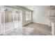 Open living space with sliding glass door and hardwood floors at 2637 Begonia Falls Ave # 87, North Las Vegas, NV 89081