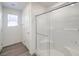 Sleek walk-in shower features glass doors and tiled walls for a modern and easy-to-maintain design at 2637 Begonia Falls Ave # 87, North Las Vegas, NV 89081