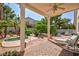 Beautiful backyard with a spa, covered patio, and a spacious area for entertaining at 270 New River Cir, Henderson, NV 89052