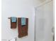 A well-lit shower stands in the corner behind a set of decorative towels at 270 New River Cir, Henderson, NV 89052