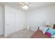This bedroom has carpet and a ceiling fan at 270 New River Cir, Henderson, NV 89052