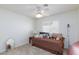 Well lit bedroom with a ceiling fan, carpet flooring, and a large window with shutters at 270 New River Cir, Henderson, NV 89052