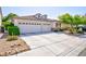 Stylish home featuring a two-car garage, attractive landscaping, and a well-maintained driveway at 270 New River Cir, Henderson, NV 89052