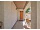 Inviting entryway with a solid wood door and neutral colored exterior paint at 270 New River Cir, Henderson, NV 89052