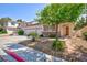 Beautiful home with stone accents, a two-car garage, and desert landscaping at 270 New River Cir, Henderson, NV 89052