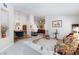 Open-concept living area with a fireplace and bar, perfect for entertaining at 270 New River Cir, Henderson, NV 89052