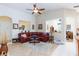 Open living area with tiled floor, leather sofa, and a view to other spaces at 270 New River Cir, Henderson, NV 89052