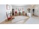 Cozy living room featuring tile floors, a rug, and ample natural light at 270 New River Cir, Henderson, NV 89052
