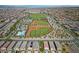 Extensive aerial view of a community highlighting the baseball field, park, and neighborhood at 2785 Donatello Manor Pl, Henderson, NV 89044
