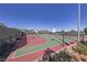 An inviting community basketball court with multiple hoops and a well-maintained, colorful surface at 2785 Donatello Manor Pl, Henderson, NV 89044