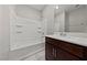 Modern bathroom featuring a tub-shower combination and dark wood vanity with solid surface countertop at 2785 Donatello Manor Pl, Henderson, NV 89044