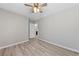 Laminate floors and ceiling fan accent this bedroom with neutral walls at 2785 Donatello Manor Pl, Henderson, NV 89044