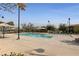 Inviting community pool with modern features and relaxing sunbathing areas at 2785 Donatello Manor Pl, Henderson, NV 89044
