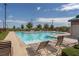 Resort-style community pool with lounge chairs, perfect for relaxing and enjoying sunny days at 2785 Donatello Manor Pl, Henderson, NV 89044